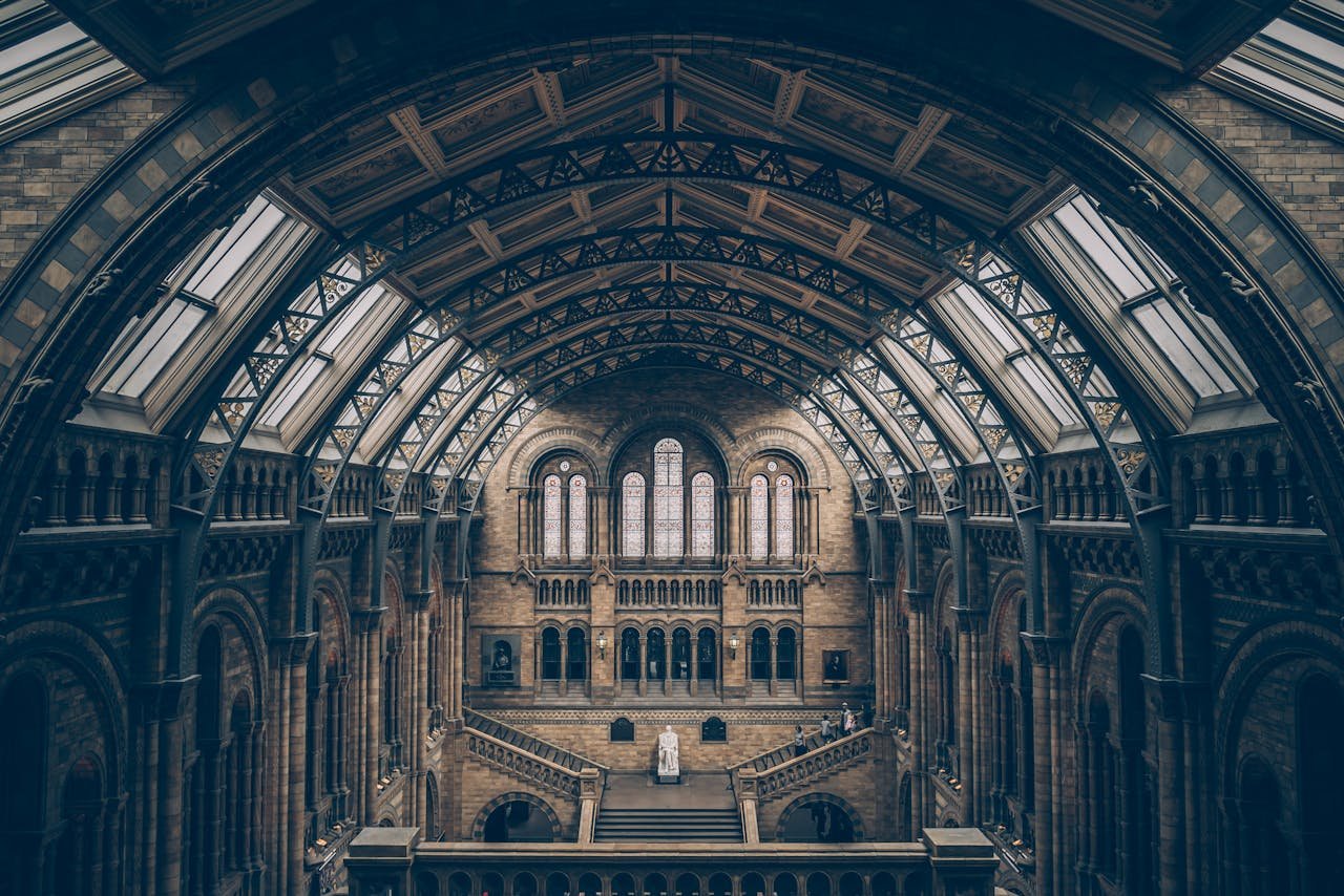 Breathtaking view of a grand museum interior showcasing intricate architectural design and symmetry.